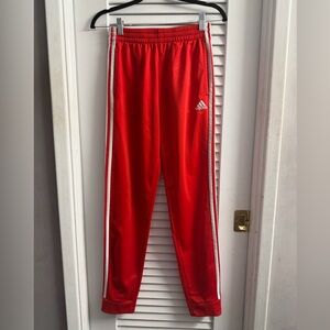 Adidas Red Coupe Joggers red with white signature stripes.Boys L 14/16 like new.